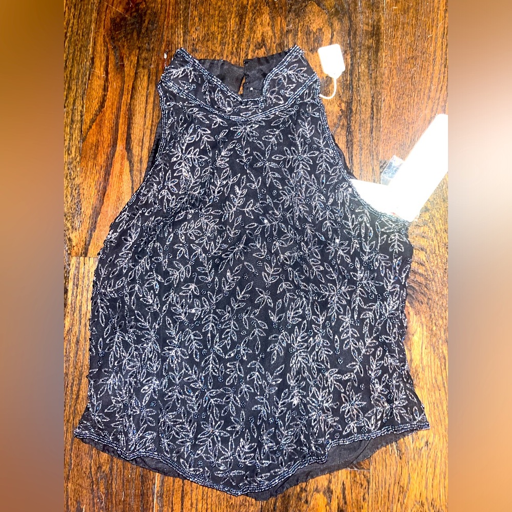 Vintage top. Beaded details. Size medium but fits like size small